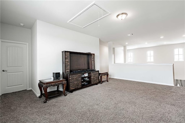 below grade area featuring visible vents, baseboards, and carpet
