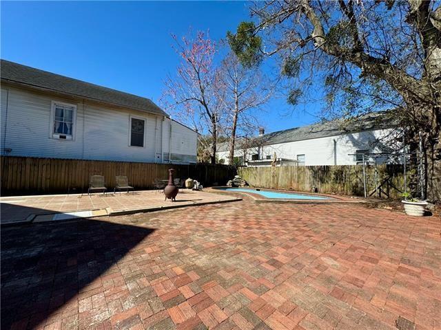 exterior space with a patio, a fenced backyard, and a fenced in pool