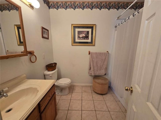 bathroom with curtained shower, baseboards, toilet, tile patterned floors, and vanity