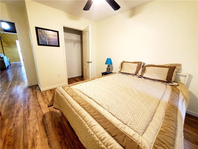 20996 Diversion Canal Rd, Saint Amant, LA 70774 - bedroom with a closet, baseboards, wood finished floors, and a ceiling fan