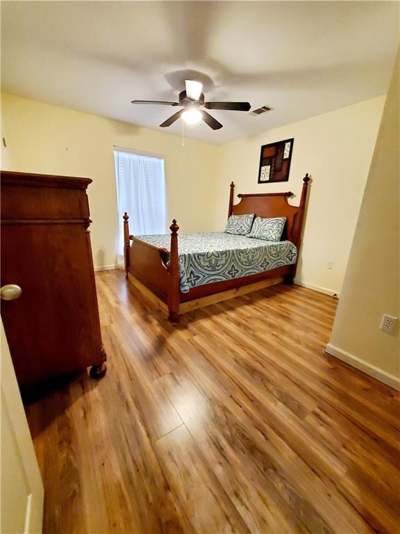 20996 Diversion Canal Rd, Saint Amant, LA 70774 - bedroom featuring visible vents, baseboards, a ceiling fan, and light wood finished floors