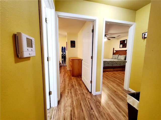 20996 Diversion Canal Rd, Saint Amant, LA 70774 - hallway featuring light wood-style flooring and baseboards
