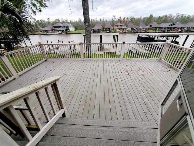 20996 Diversion Canal Rd, Saint Amant, LA 70774 - wooden deck with a water view and a residential view