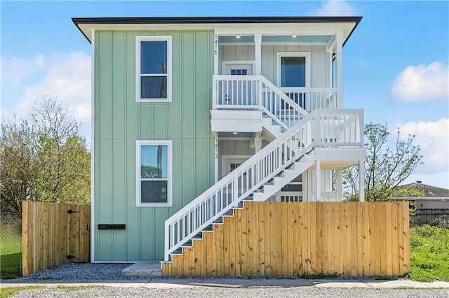 1413 Gordon St, New Orleans, LA 70117 - view of front facade with stairway and board and batten siding
