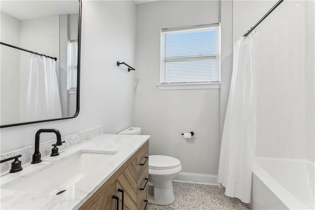 bathroom featuring toilet, vanity, tile patterned flooring, and shower / bath combo with shower curtain