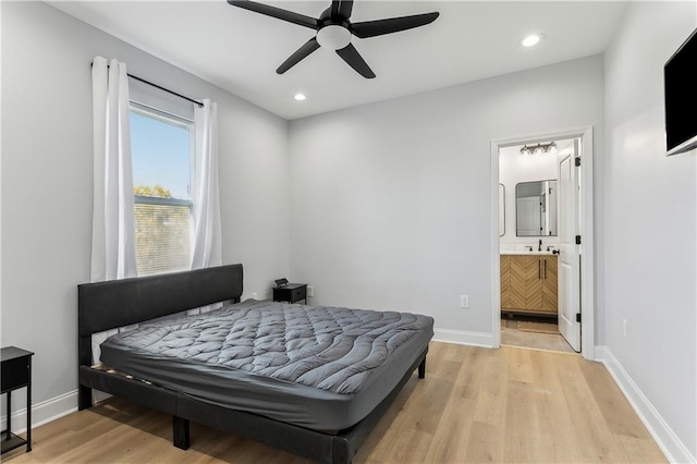 1413 Gordon St, New Orleans, LA 70117 - bedroom featuring light wood-style flooring, baseboards, recessed lighting, ceiling fan, and ensuite bathroom
