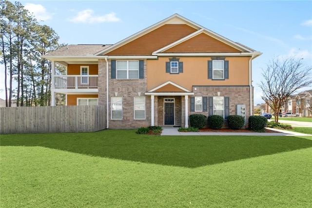 multi unit property featuring fence and a front lawn