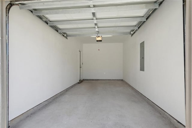 garage featuring a garage door opener and electric panel