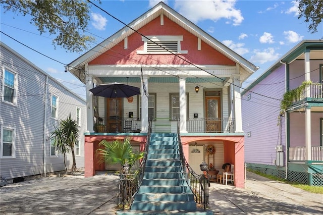 320709 Bienville St, New Orleans, LA 70119 - shotgun-style home with a porch and stairs