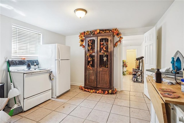 320709 Bienville St, New Orleans, LA 70119 - kitchen with light tile patterned flooring and white appliances