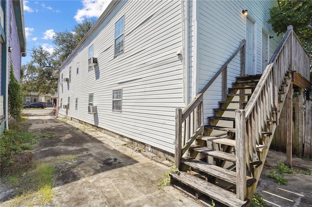 320709 Bienville St, New Orleans, LA 70119 - view of property exterior featuring cooling unit and stairs