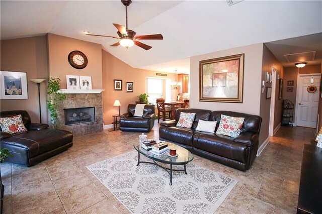 4504 Stella Dr, Meraux, LA 70075 - living area with baseboards, a tiled fireplace, attic access, lofted ceiling, and a ceiling fan