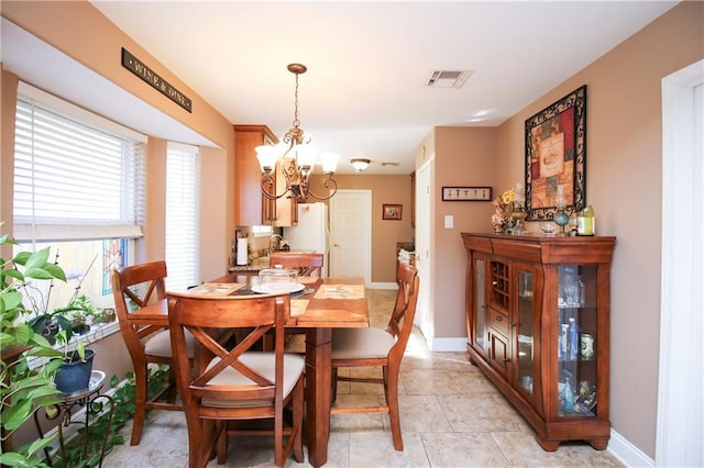 4504 Stella Dr, Meraux, LA 70075 - dining room with light tile patterned floors, visible vents, baseboards, and an inviting chandelier