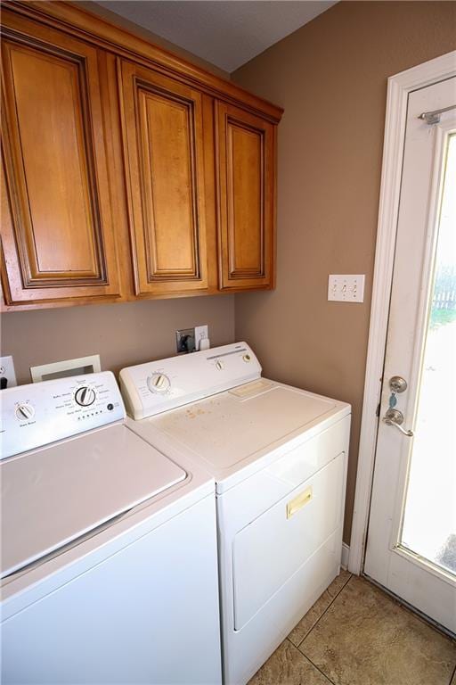 4504 Stella Dr, Meraux, LA 70075 - washroom with washer and dryer, cabinet space, and light tile patterned floors