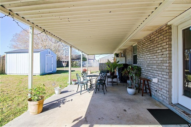 4504 Stella Dr, Meraux, LA 70075 - view of patio featuring an outbuilding, a shed, and fence