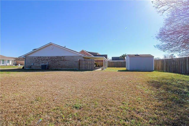 4504 Stella Dr, Meraux, LA 70075 - view of yard with an outdoor structure, a shed, and fence