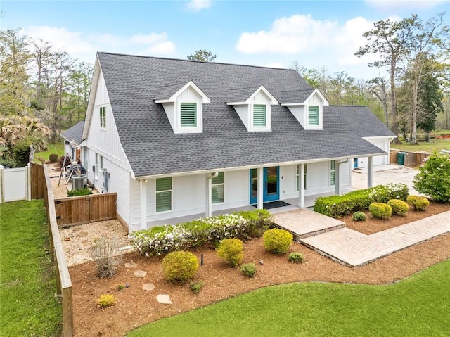 view of front of house with covered porch and roof with shingles