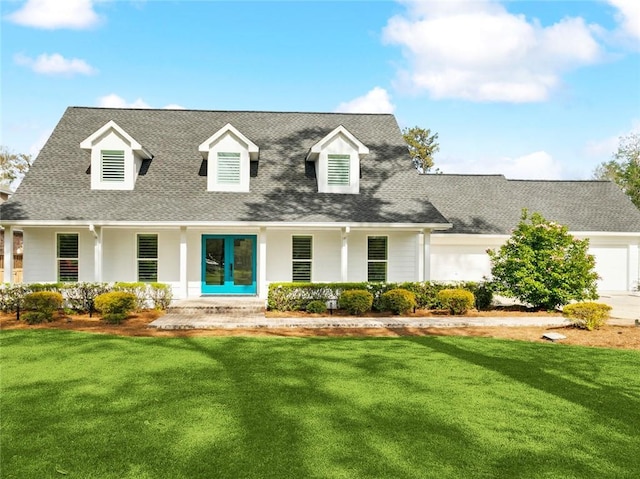 cape cod house with a front lawn, covered porch, an attached garage, and a shingled roof