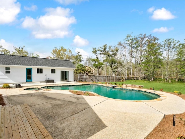 view of pool with a patio and a pool with connected hot tub