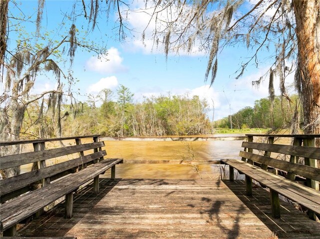dock area featuring a wooded view