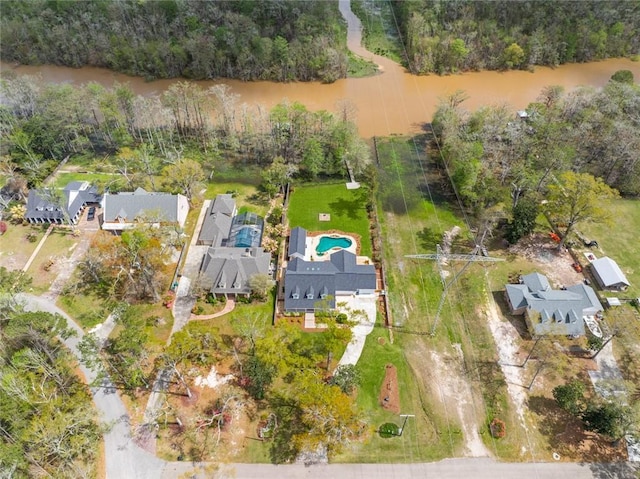 aerial perspective of suburban area featuring a pool area