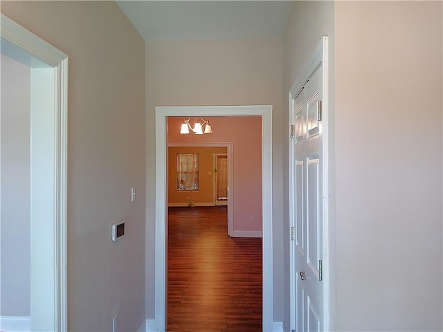 4800 Eastview Dr, New Orleans, LA 70126 - hallway with dark wood-style floors and baseboards