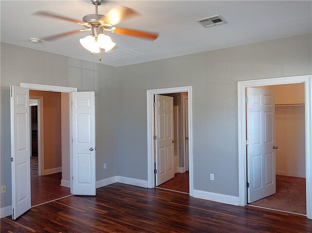 4800 Eastview Dr, New Orleans, LA 70126 - unfurnished bedroom with baseboards, visible vents, a ceiling fan, and wood finished floors