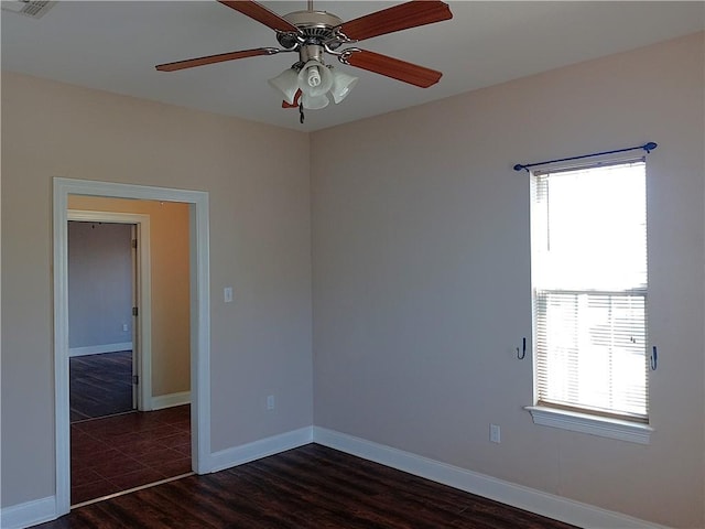 4800 Eastview Dr, New Orleans, LA 70126 - empty room with dark wood-type flooring, baseboards, and ceiling fan
