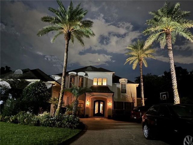 192 Forest Oaks Dr, New Orleans, LA 70131 - mediterranean / spanish-style house with french doors and stucco siding