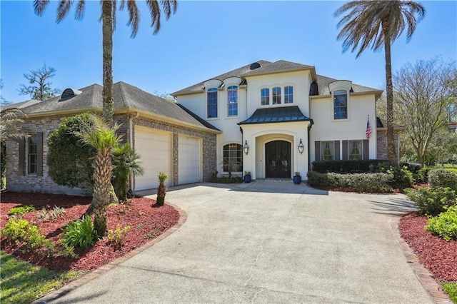 192 Forest Oaks Dr, New Orleans, LA 70131 - view of front of property featuring stucco siding, an attached garage, and concrete driveway