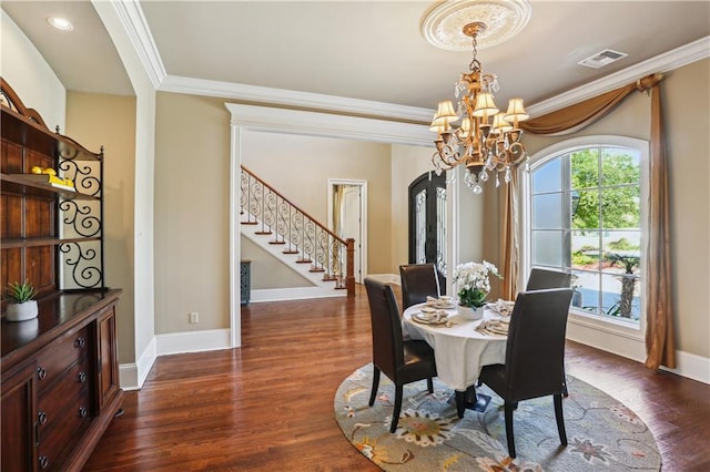 192 Forest Oaks Dr, New Orleans, LA 70131 - dining space featuring visible vents, crown molding, a chandelier, stairs, and dark wood-style flooring