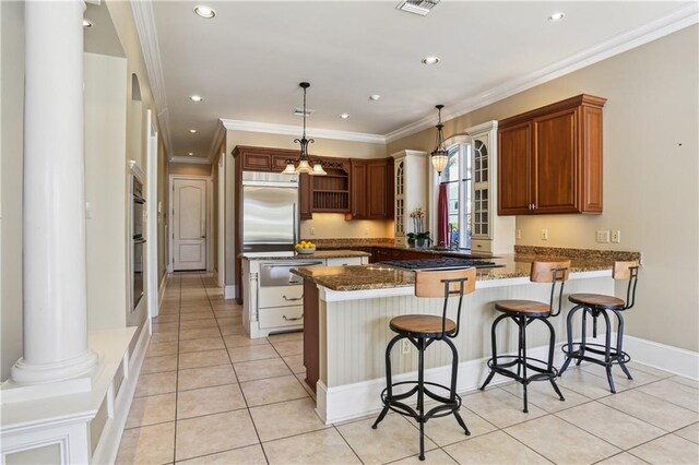 192 Forest Oaks Dr, New Orleans, LA 70131 - kitchen featuring crown molding, dark stone counters, a peninsula, stainless steel appliances, and a warming drawer