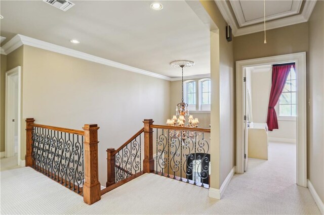 192 Forest Oaks Dr, New Orleans, LA 70131 - hall featuring carpet floors, attic access, crown molding, an upstairs landing, and a wealth of natural light