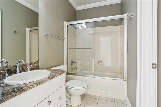 192 Forest Oaks Dr, New Orleans, LA 70131 - bathroom with tile patterned floors, toilet, crown molding, bath / shower combo with glass door, and vanity
