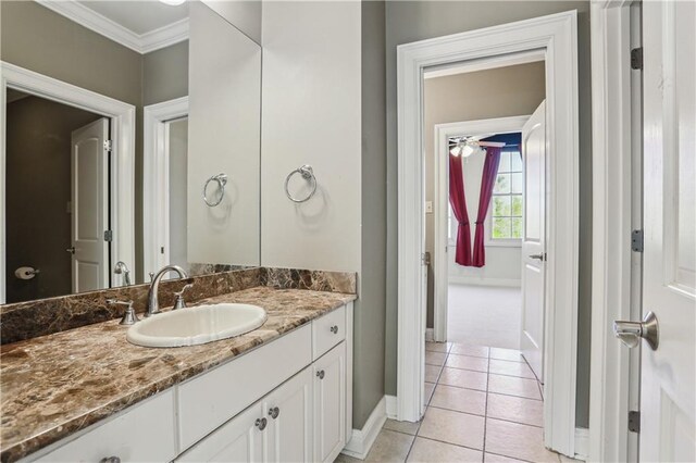 192 Forest Oaks Dr, New Orleans, LA 70131 - bathroom with tile patterned floors, baseboards, vanity, and crown molding