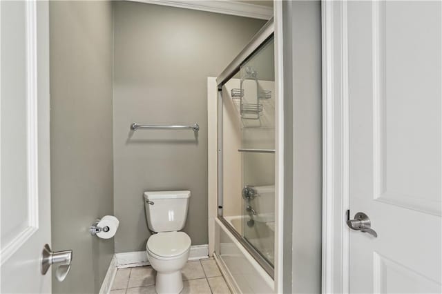 192 Forest Oaks Dr, New Orleans, LA 70131 - bathroom featuring baseboards, toilet, shower / bath combination with glass door, and tile patterned flooring