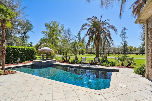 192 Forest Oaks Dr, New Orleans, LA 70131 - view of swimming pool with a lawn, a pool with connected hot tub, and a patio area