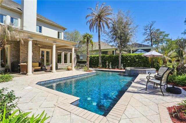 192 Forest Oaks Dr, New Orleans, LA 70131 - view of swimming pool featuring an outdoor hangout area, a pool with connected hot tub, a ceiling fan, and a patio area