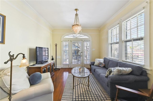 1930 N Rampart St, New Orleans, LA 70116 - living area with wood finished floors, healthy amount of natural light, a chandelier, crown molding, and french doors
