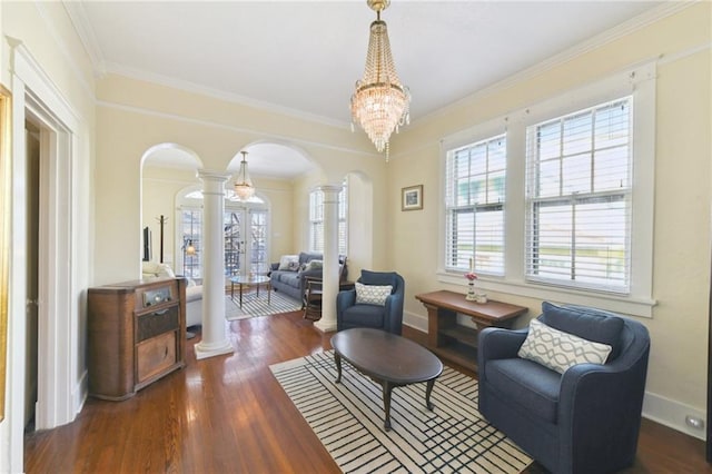 1930 N Rampart St, New Orleans, LA 70116 - sitting room with arched walkways, decorative columns, crown molding, wood finished floors, and baseboards