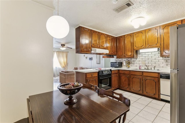kitchen with visible vents, ceiling fan, black appliances, light countertops, and under cabinet range hood