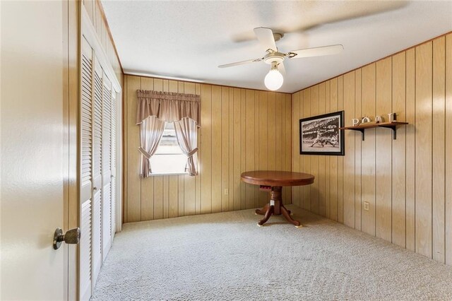 carpeted empty room with ceiling fan
