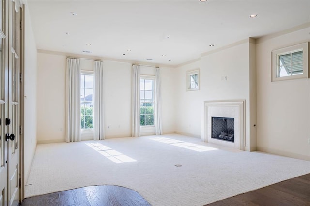 989 Beauregard Pkwy, Covington, LA 70433 - unfurnished living room featuring recessed lighting, baseboards, a fireplace with flush hearth, and wood finished floors