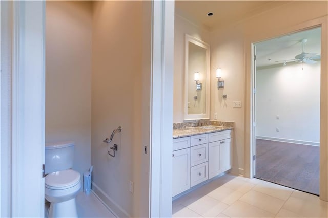 989 Beauregard Pkwy, Covington, LA 70433 - bathroom with vanity, a ceiling fan, baseboards, and toilet