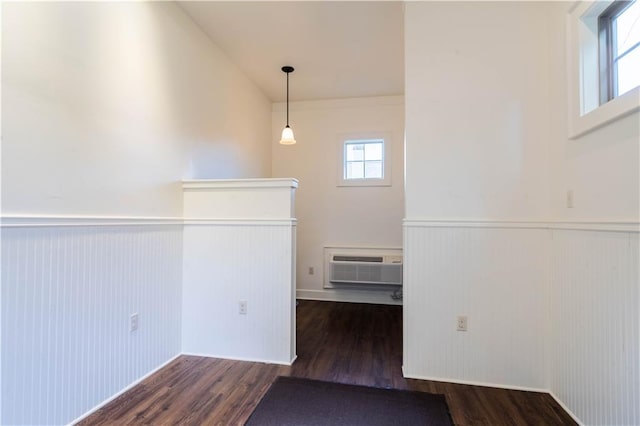 989 Beauregard Pkwy, Covington, LA 70433 - unfurnished room with a wainscoted wall, a wall mounted air conditioner, and wood finished floors