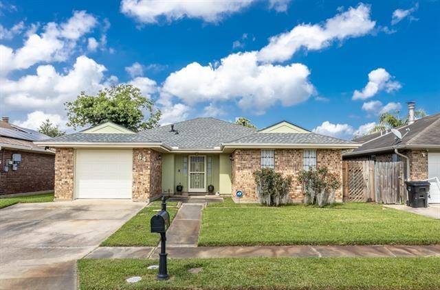 64 Marywood Ct, New Orleans, LA 70128 - single story home with fence, concrete driveway, a front yard, a garage, and brick siding