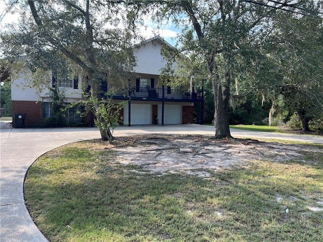 34062 Laurent Rd, Slidell, LA 70460 - obstructed view of property with a garage, driveway, and brick siding