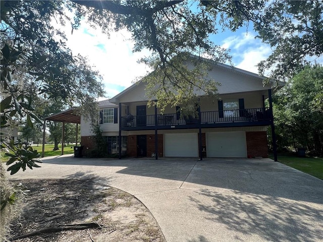34062 Laurent Rd, Slidell, LA 70460 - view of front facade featuring driveway, brick siding, and an attached garage