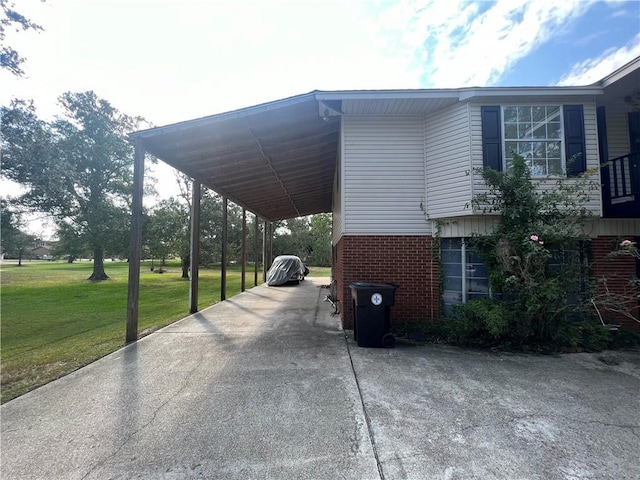 34062 Laurent Rd, Slidell, LA 70460 - view of parking featuring driveway and a carport