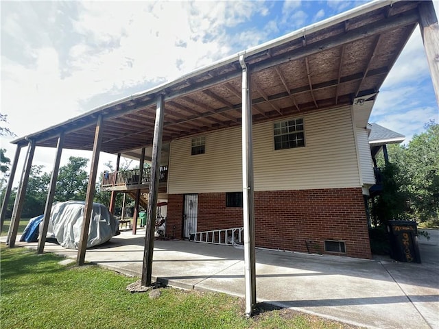 34062 Laurent Rd, Slidell, LA 70460 - view of vehicle parking featuring a carport, stairway, and concrete driveway